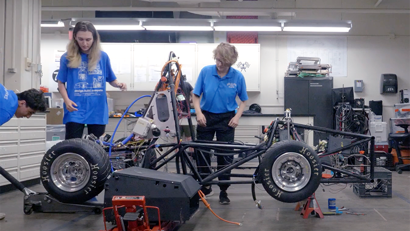 Students work on electric race car