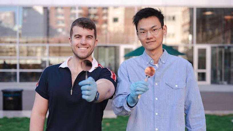 Jacob Amontree (left) and Xingzhou Yan (right) displaying their pristine CVD graphene synthesized on ultra-flat copper/sapphire wafers.